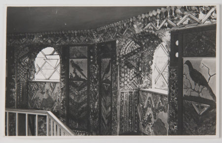 The Shell Gallery, A La Ronde, Devon. Black and white photograph of shell gallery showing 2 windows.