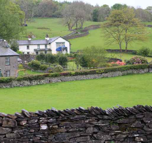 a view of Castle Cottage from the white gate of Hill Top