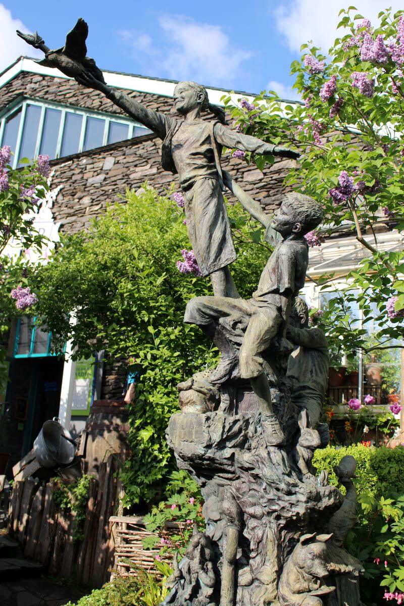 a bronze sculpture at the garden of the World of Beatrix Potter Attraction