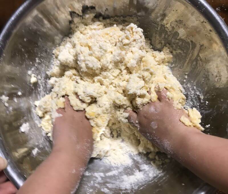 mixing plain flour. butter, egg, milk, sugar, and solt