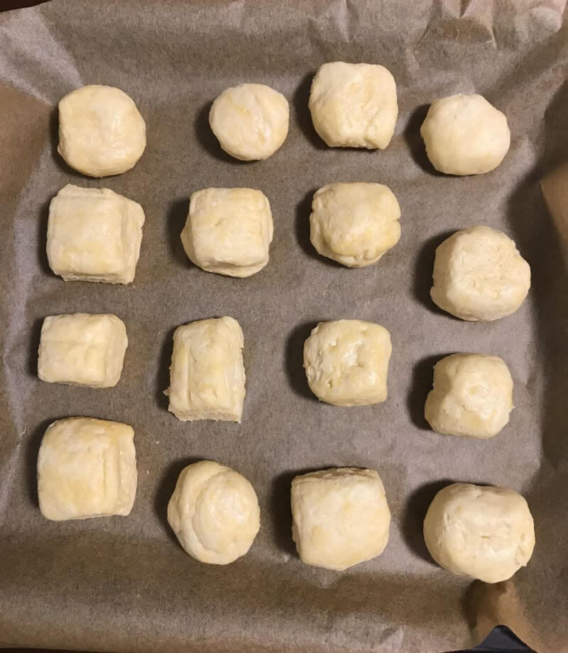 put cut pastries on a baking pan