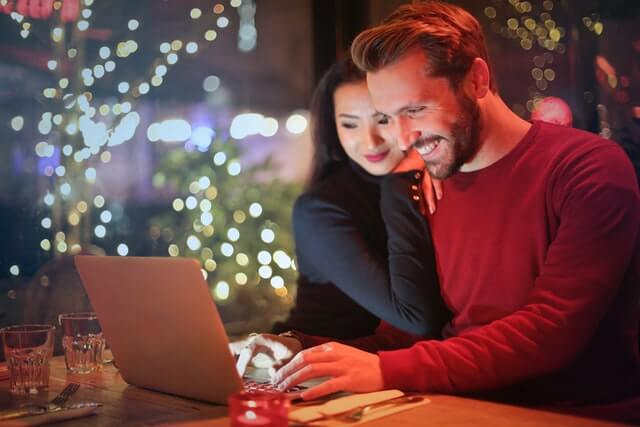 A couple looking at a laptop