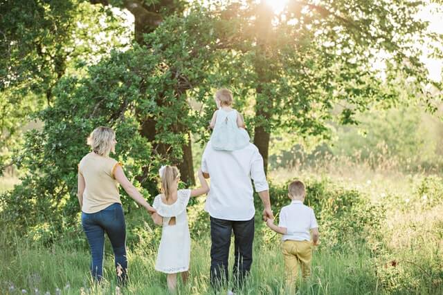 a family walking in the grass