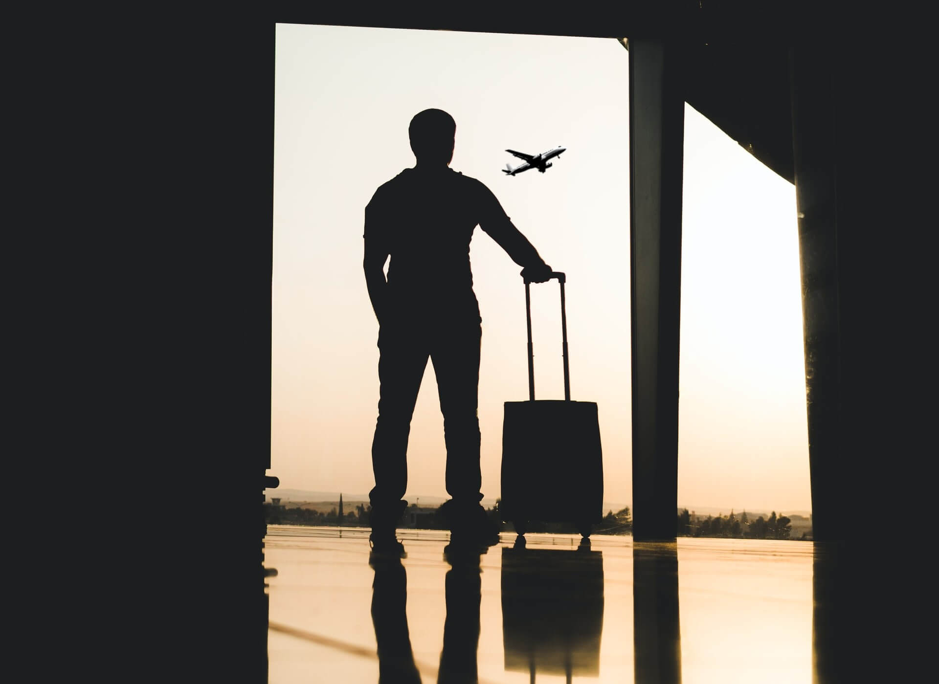 a man looking an airplane at a airport
