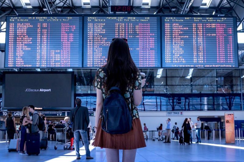 a girl watching the timetable