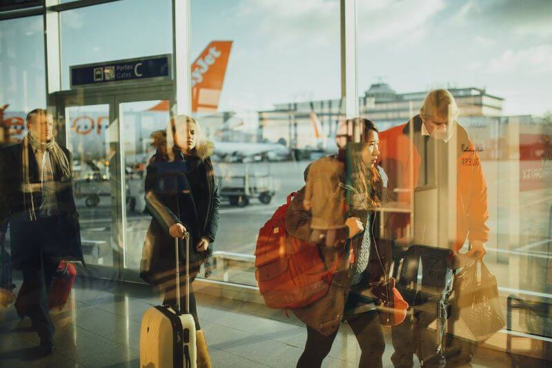travellers walking in airport