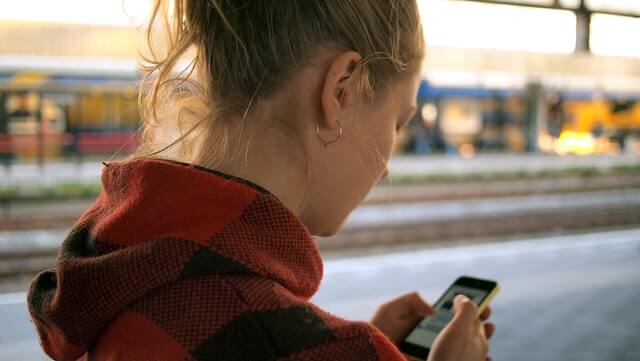 a girl watching a smart phone