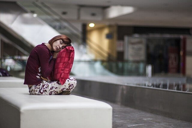 a woman sitting and sleeping